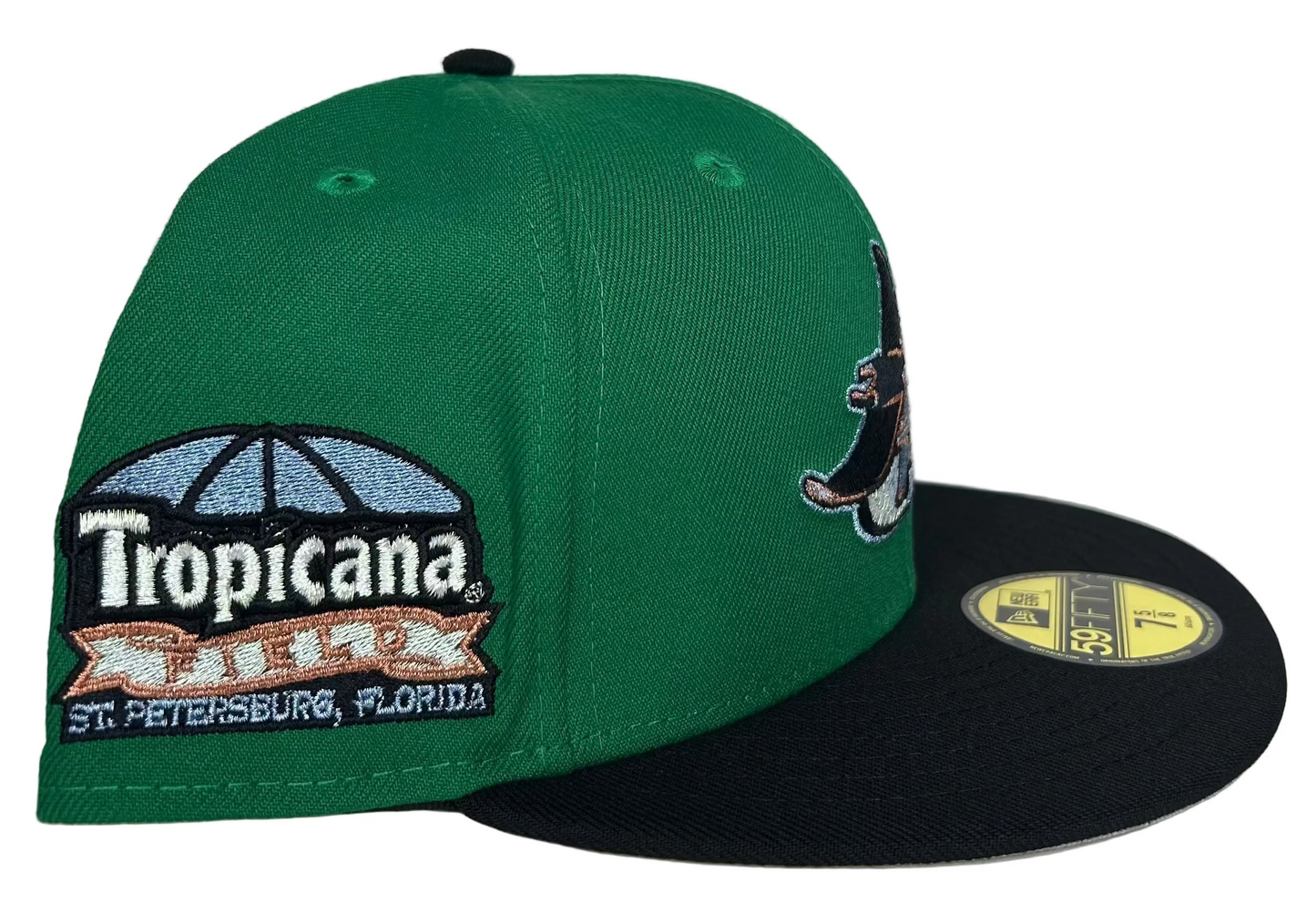 New Era Tampa Bay Rays 59FIFTY fitted hat featuring a green crown, black visor, and a Tropicana Field side patch.
