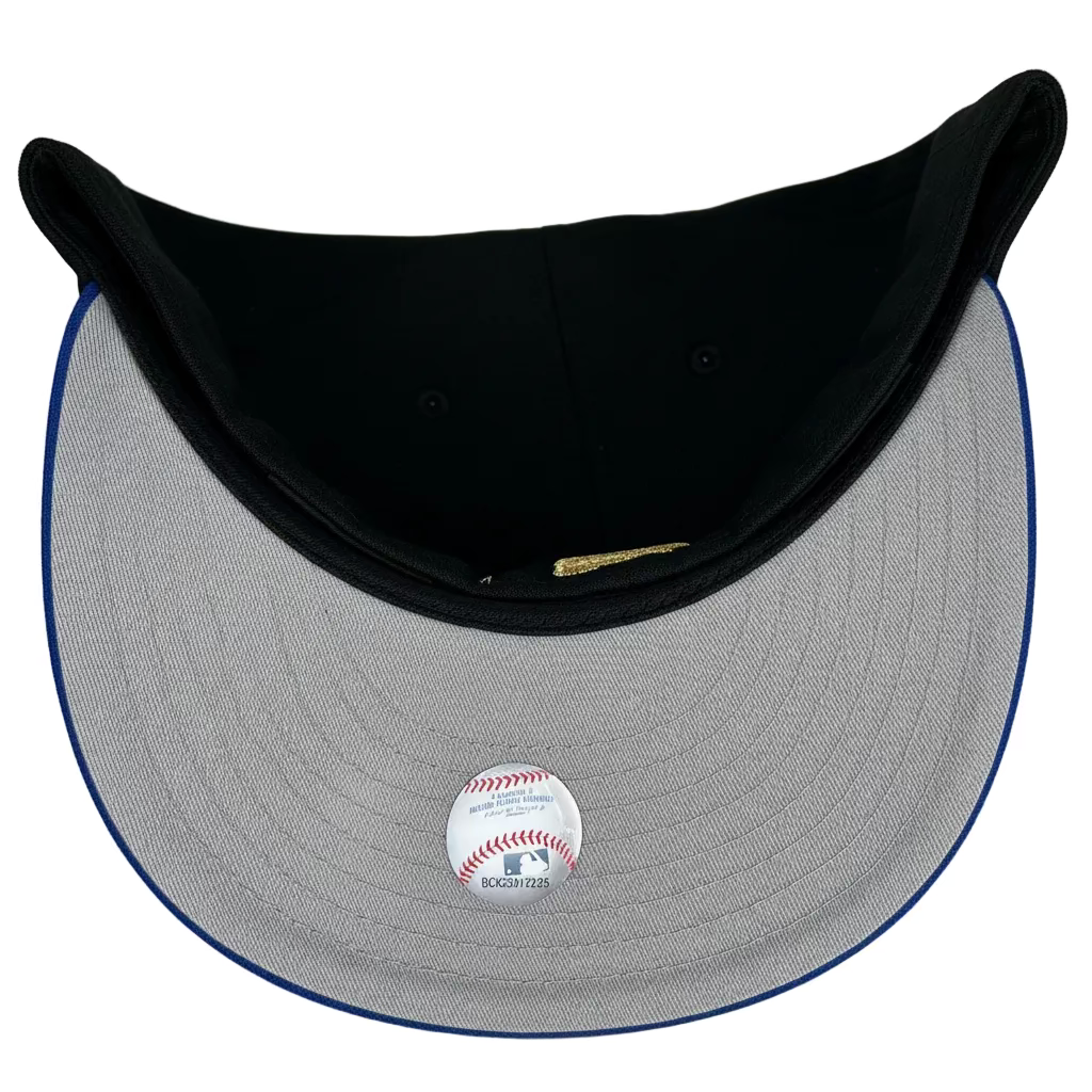 New Era Oakland Athletics 59FIFTY fitted cap featuring a black crown, royal blue visor, and an upside-down yellow embroidered logo.