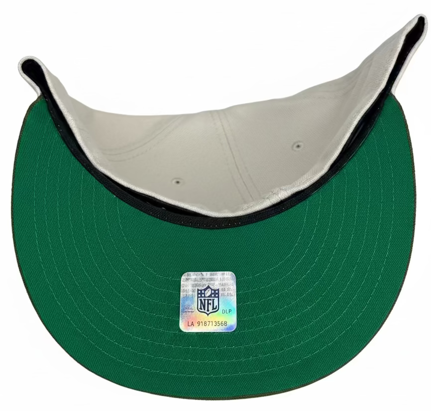 New Era Chicago Bears 59FIFTY fitted hat with a tan crown, green brim, and a "Super Bowl 1985 Champions" patch on the side.