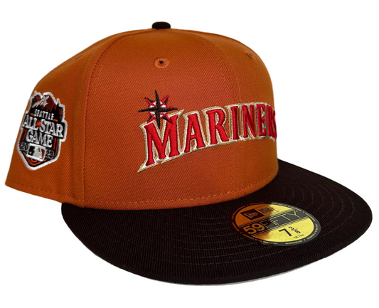 New Era Seattle Mariners 59FIFTY fitted hat with a burnt orange crown and a brown visor, commemorating the 2023 All-Star Game.
