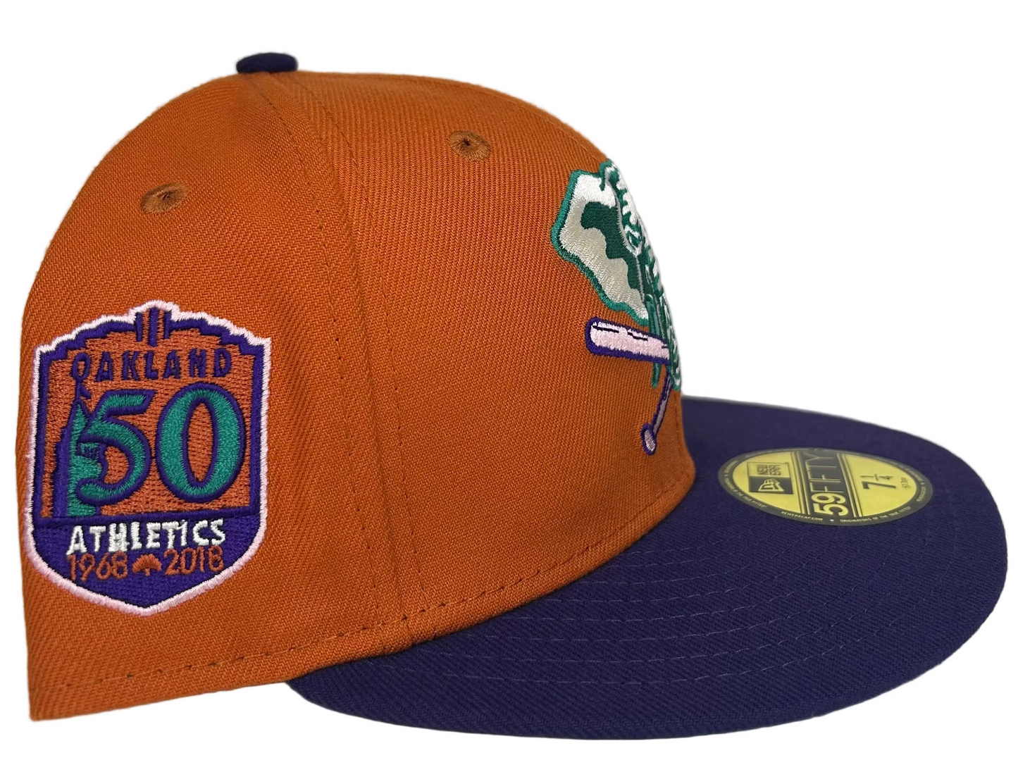 New Era Cactus Fruit Oakland Athletics 50th Anniversary Patch Stomper Hat features a burnt orange crown, a purple brim, a green under-visor, and a 50th-anniversary patch.