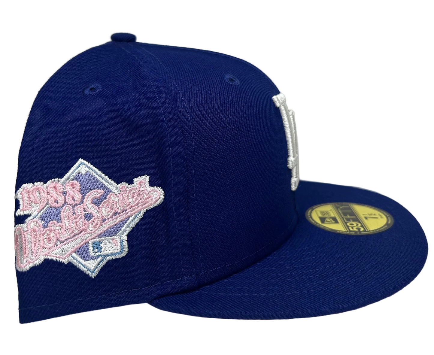 New Era Los Angeles Dodgers 59Fifty fitted hats featuring a royal blue crown and a light pink undervisor.