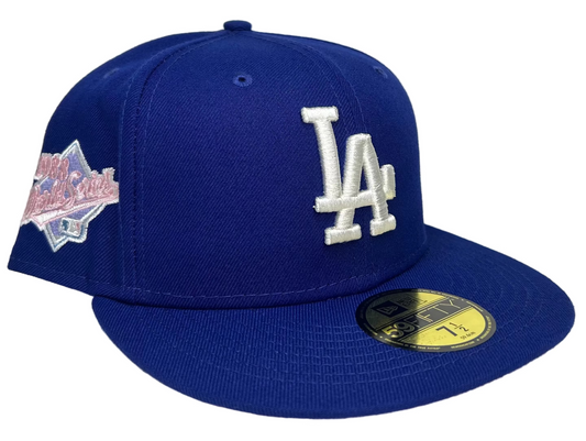 New Era Los Angeles Dodgers 59Fifty fitted hats featuring a royal blue crown and a light pink undervisor.