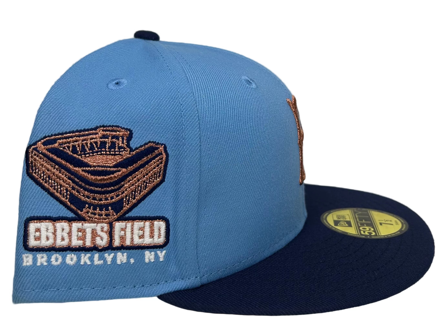 New Era Brooklyn Dodgers 59FIFTY fitted hat with a sky blue crown, navy visor, and copper embroidered logo.