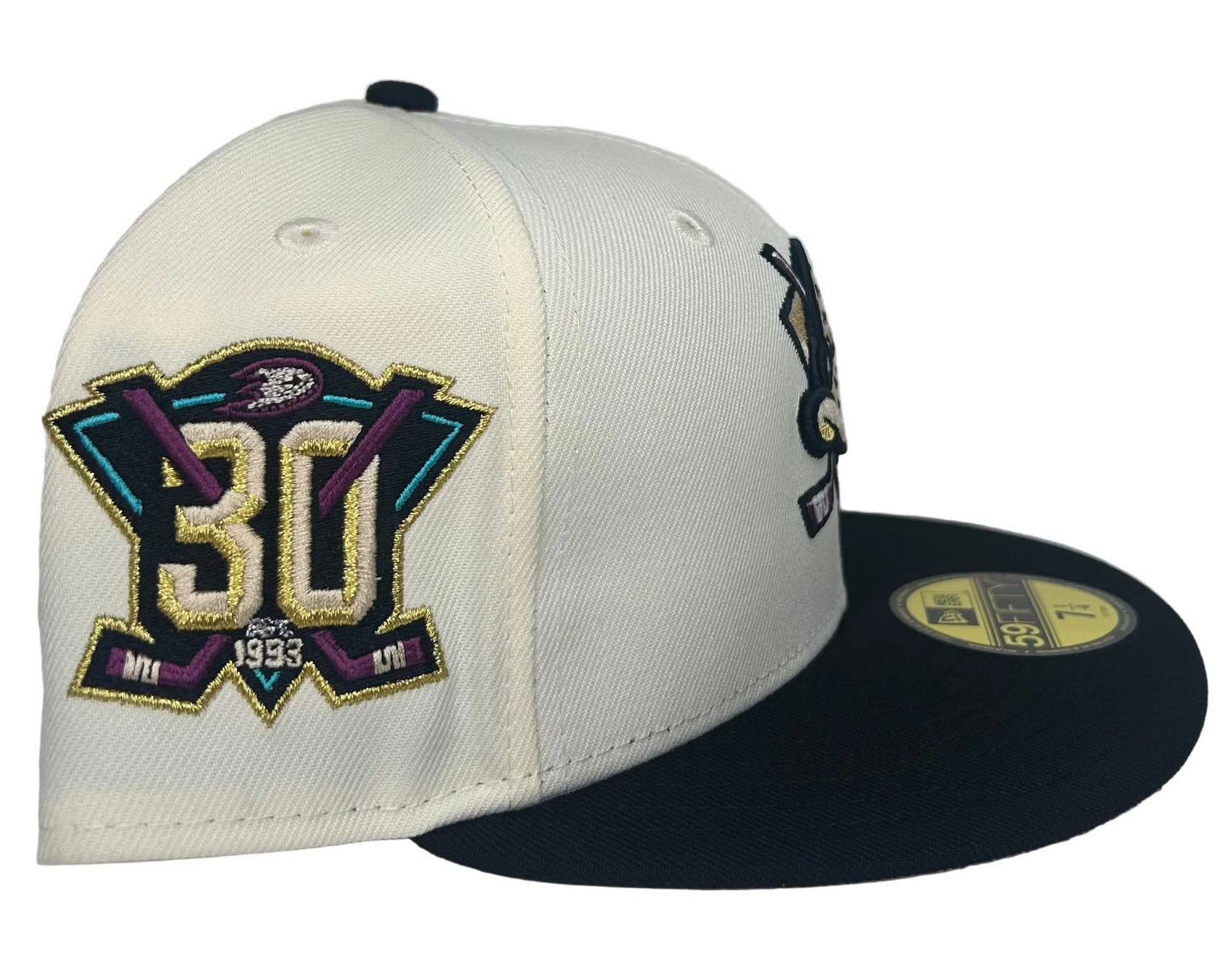 New Era Anaheim Ducks 59FIFTY 30th anniversary fitted cap featuring a chrome white crown, black visor, and pink undervisor.