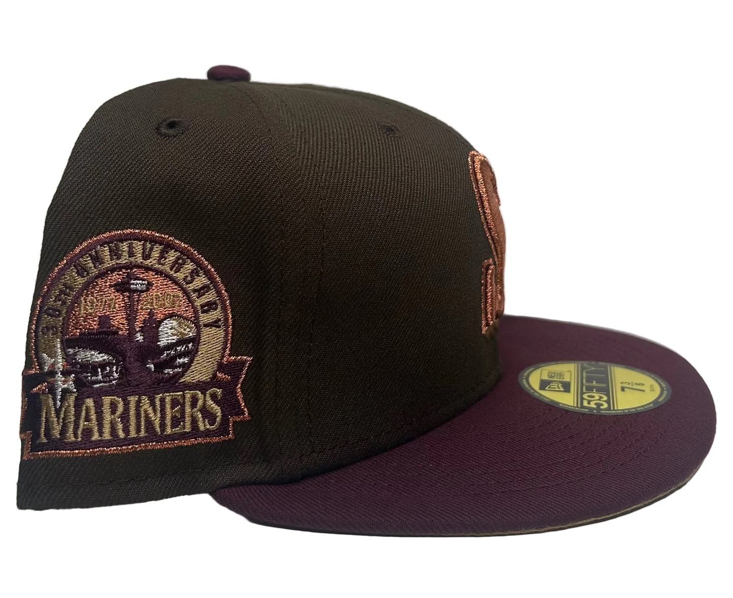 New Era Seattle Mariners 30th Anniversary Community Edition 59Fifty fitted hat in a brown colorway with a maroon visor.