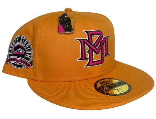 New Era Milwaukee Brewers "Dunkin Collection" 59FIFTY fitted hat features a vibrant fall orange color and a "County Stadium" side patch.