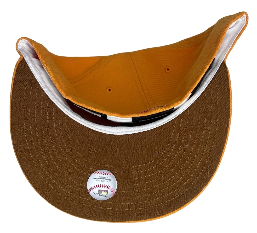 New Era Milwaukee Brewers "Dunkin Collection" 59FIFTY fitted hat features a vibrant fall orange color and a "County Stadium" side patch.