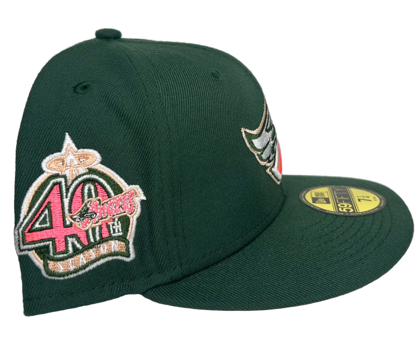 New Era 59FIFTY fitted hat features a deep green crown and a 50th-anniversary patch on the side.