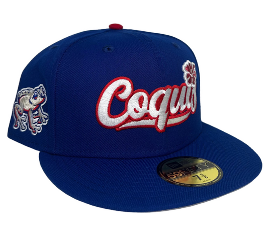 New Era Lehigh Valley IronPigs "Coquis" 59FIFTY fitted cap features a prominent embroidered "Coquis" logo on the front and a coqui frog patch on the side.