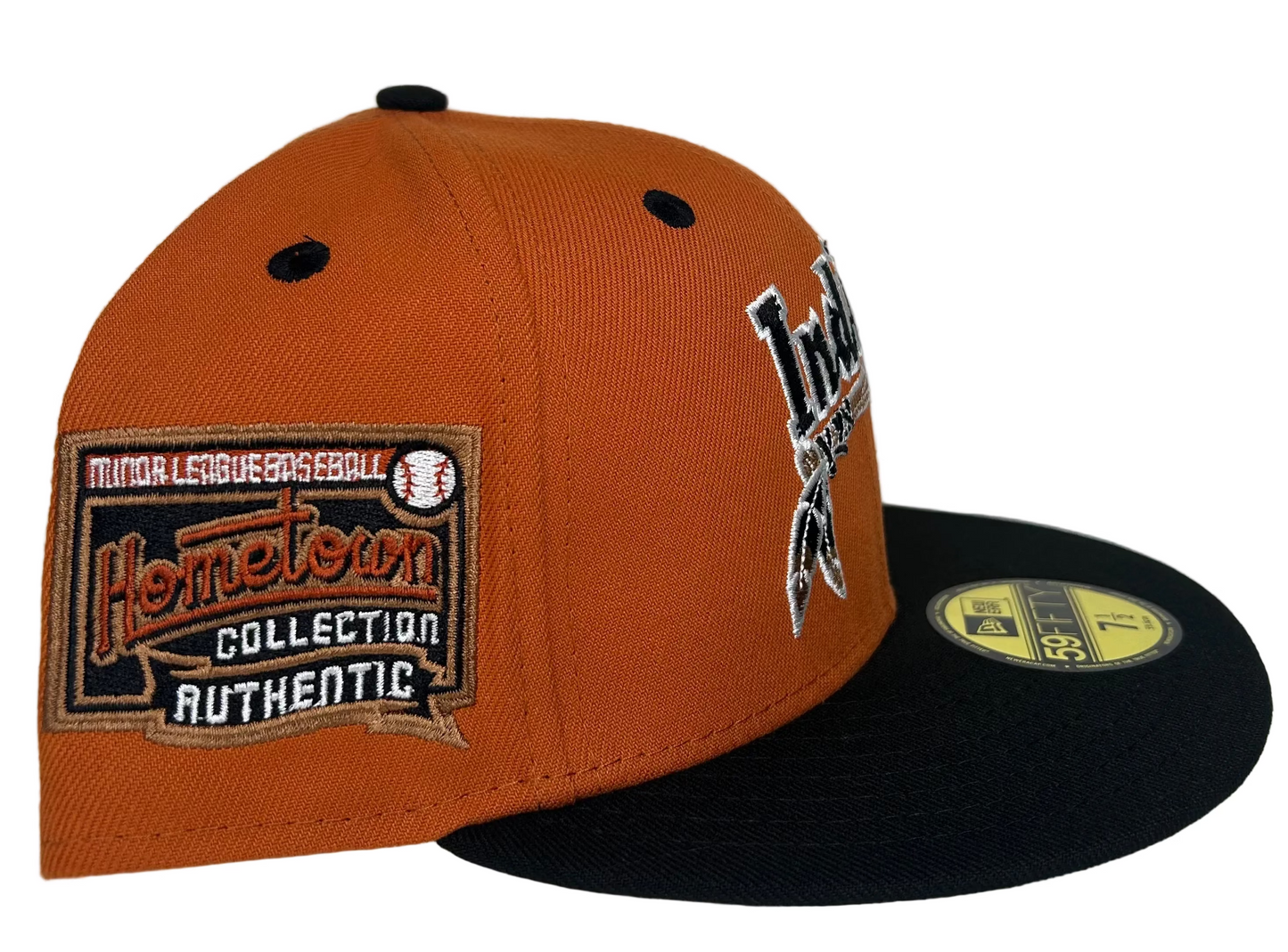 New Era 59FIFTY fitted hat features an orange crown and a black visor with a throwback Cleveland Indians "Hometown Collection" logo patch on the side.