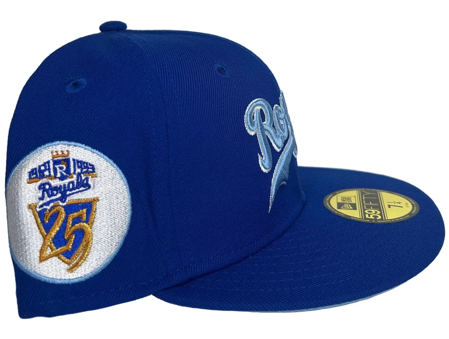 Kansas City Royals New Era 59FIFTY fitted cap features a light blue script logo against a royal blue crown and a 25th-anniversary patch.