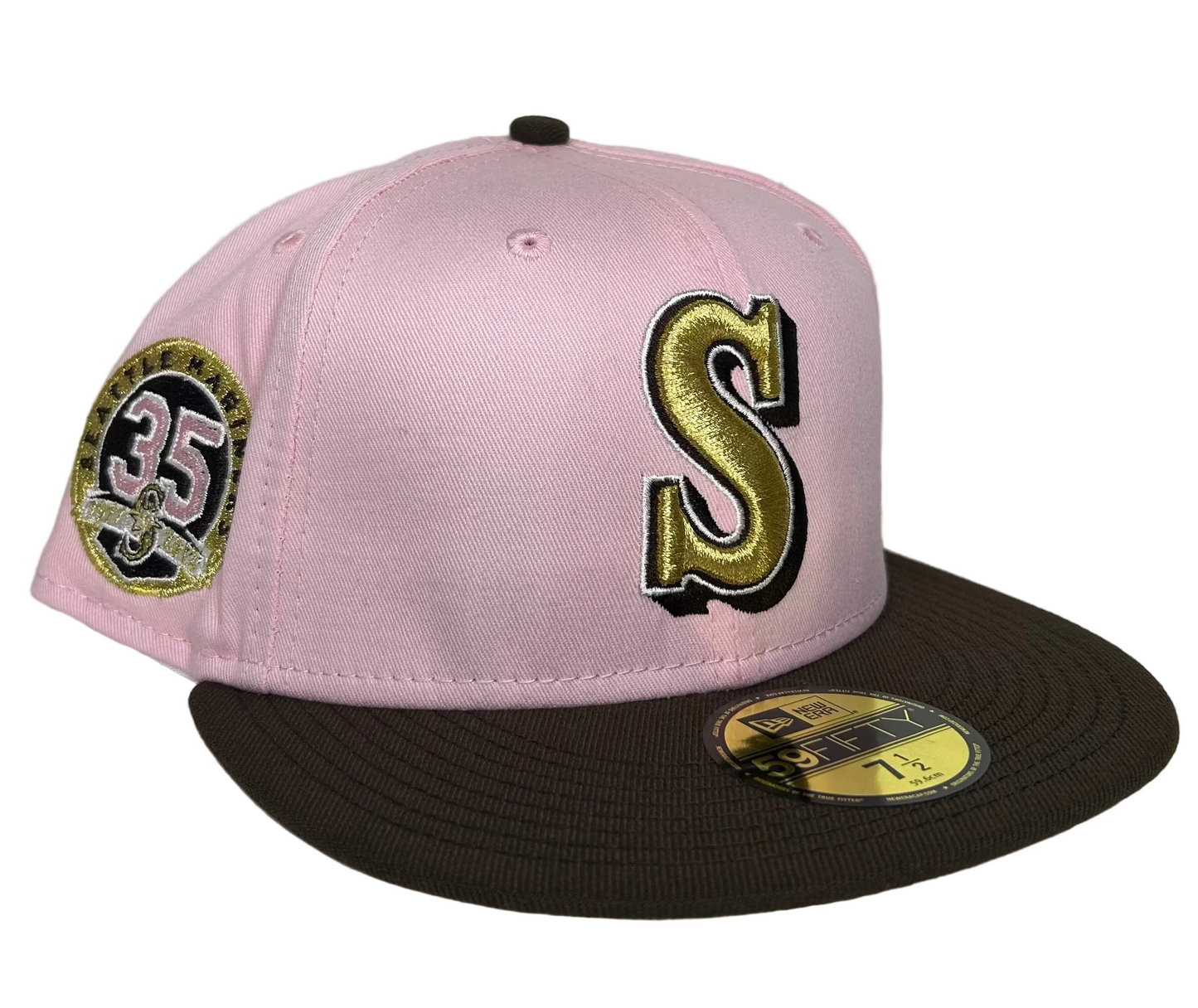 New Era 59Fifty Seattle Mariners fitted hat features a distinctive pink crown with a chocolate brown brim and a 35th Anniversary patch on the side.