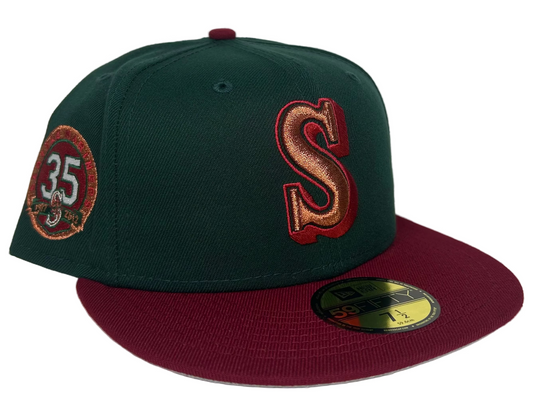 New Era Seattle Mariners Color Flip 35th Anniversary Edition 59Fifty fitted hat featuring a dark green crown and a maroon brim.