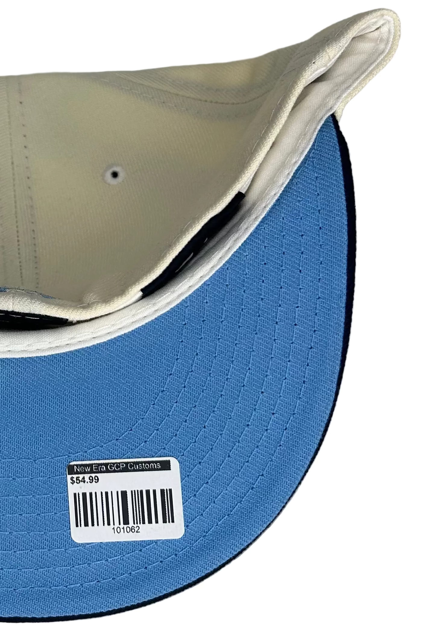 New Era 59FIFTY Seattle Mariners fitted hat features a cream crown, navy brim, and a special 40th-anniversary patch on the side.