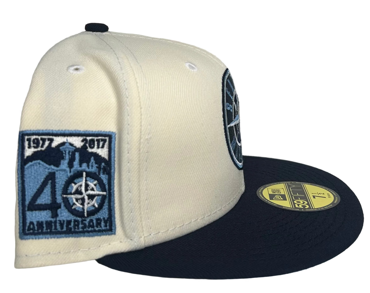 New Era 59FIFTY Seattle Mariners fitted hat features a cream crown, navy brim, and a special 40th-anniversary patch on the side.
