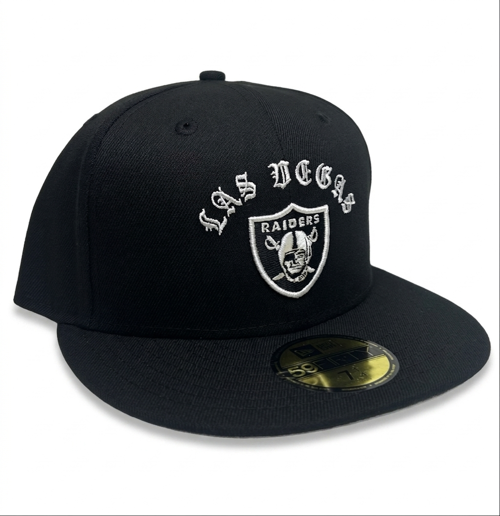 New Era Las Vegas Raiders "Gothic Arch" 59FIFTY fitted hat features white embroidered gothic-style "LAS VEGAS" lettering above the official team logo.