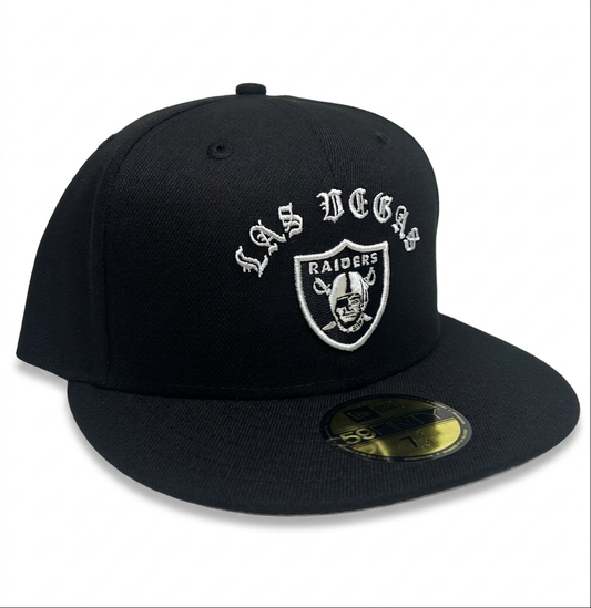 New Era Las Vegas Raiders "Gothic Arch" 59FIFTY fitted hat features white embroidered gothic-style "LAS VEGAS" lettering above the official team logo.