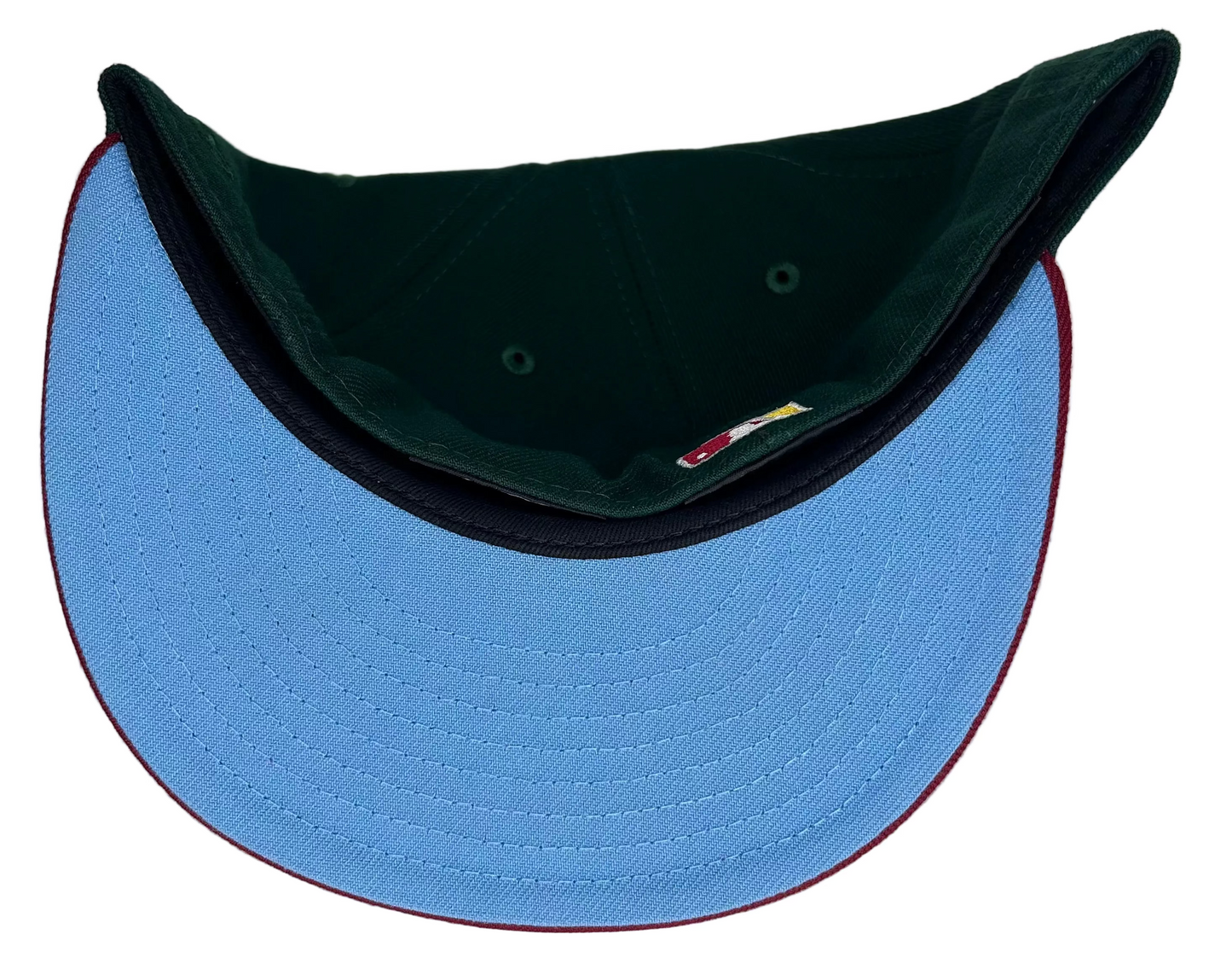 New Era Oakland Athletics 59FIFTY fitted hat featuring a dark green crown, maroon brim, and a 1989 World Series patch.