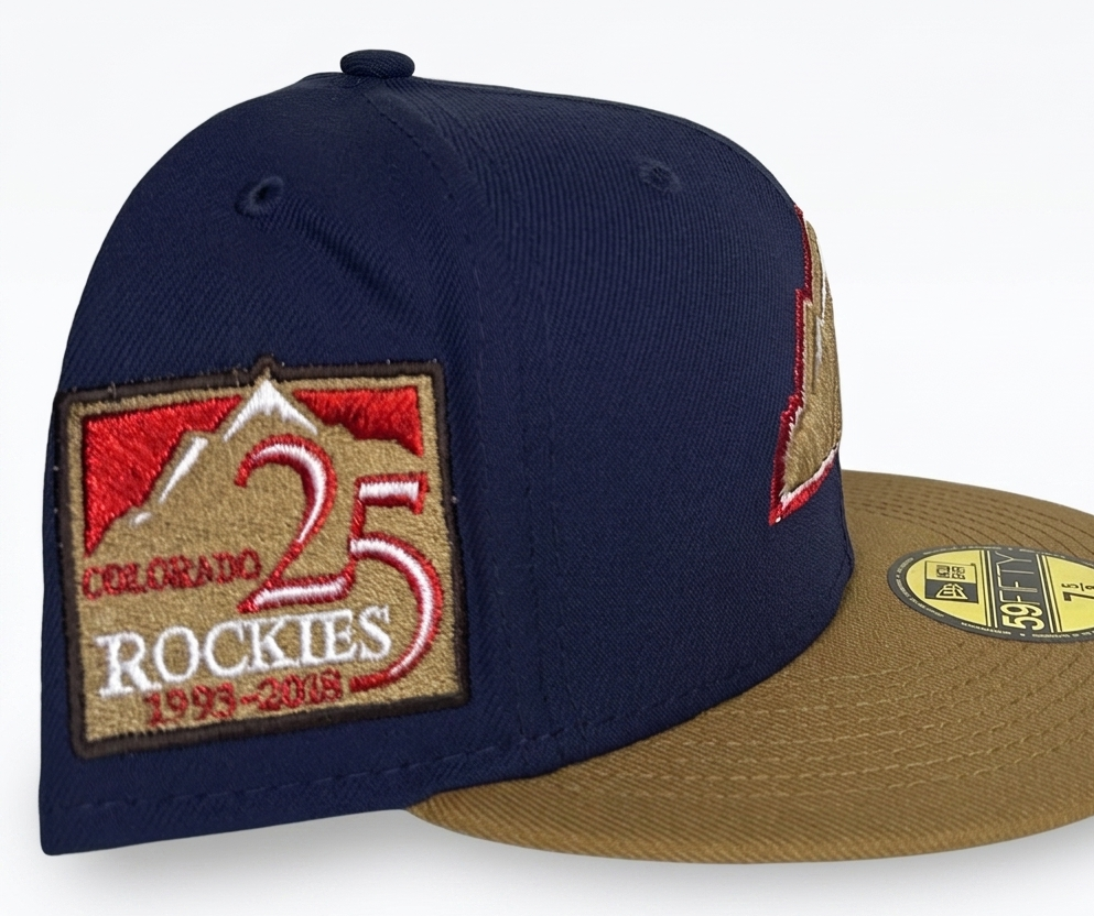 Colorado Rockies New Era 59Fifty fitted hat featuring a 25th Anniversary side patch and a gold and white mountain logo.