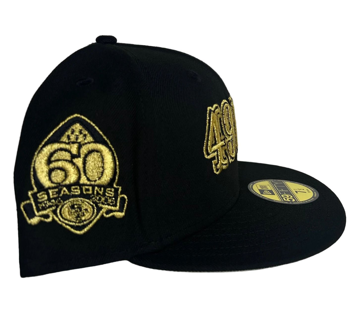 New Era 59FIFTY fitted hat features gold embroidered "49ERS" script on a black crown and a "60 Seasons" patch on the side.